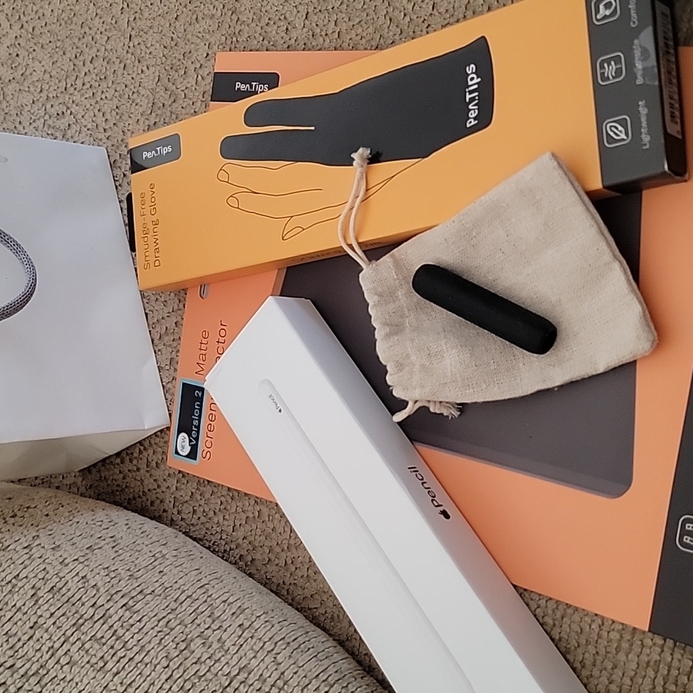 Apple pencil, screenprotector, drawing glove, and a pencil grip.